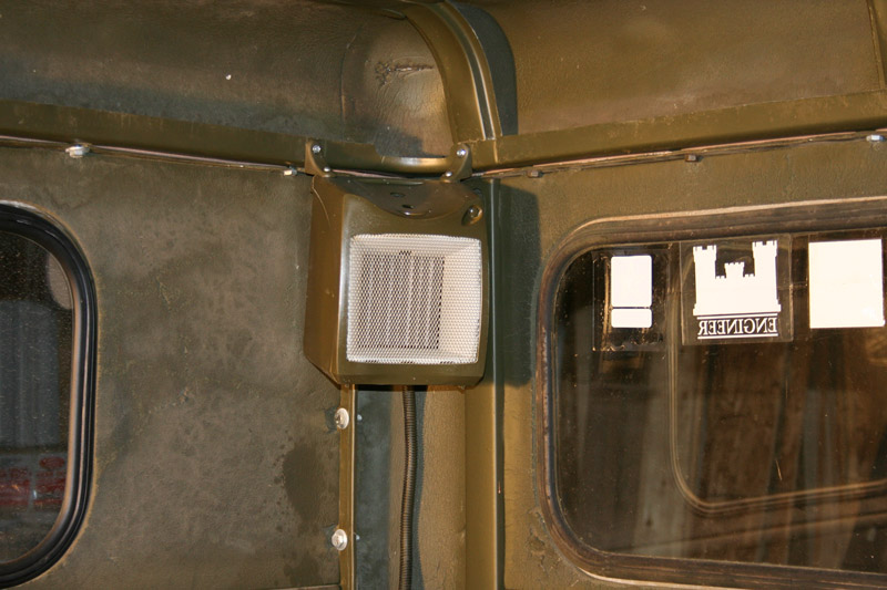 Heater mounted in rear corner of winter cab