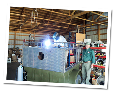 Mike watching Don weld frame