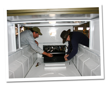 Mike and Steve bolting down air compressor